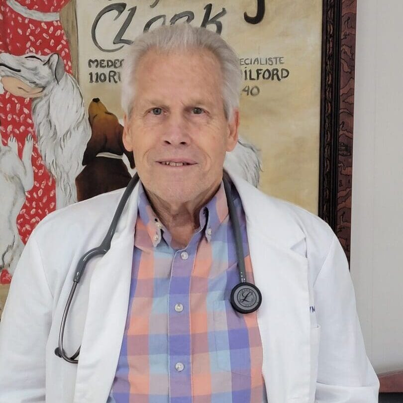 Veterinarian in white coat wearing a stethoscope
